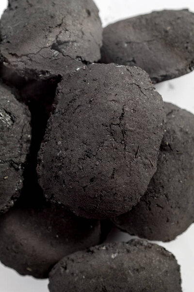 black coal isolated on white background, close up