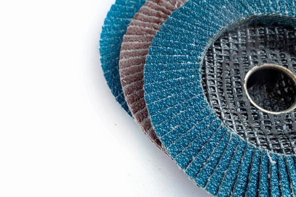 Abrasive flap discs for metal grinding and surface finishing, arranged on a white background. Ideal for industrial design, tool catalogs,