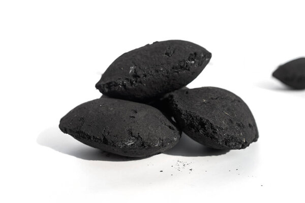 black coal isolated on white background, close up