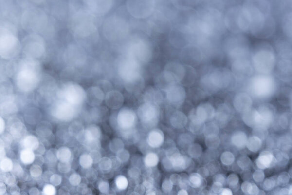 Abstract Silver Water Drop Bokeh with Sparkling Macro Droplets A high-quality macro shot of sparkling water droplets creating a stunning silver and light blue bokeh effect