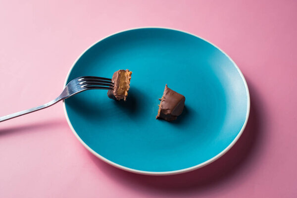 A cut dessert on plate.