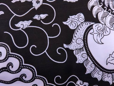 Siyah beyaz batik desenler, tekstil tasarımı, moda baskıları ve kültürel arka planlar için mükemmel..