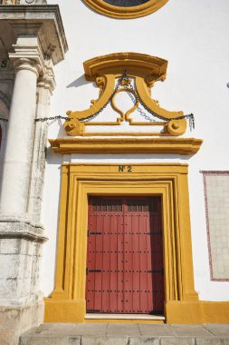 Old wooden entrance doors in the bullring used for bullfights, Seville, Andalusia, Spain, Europe