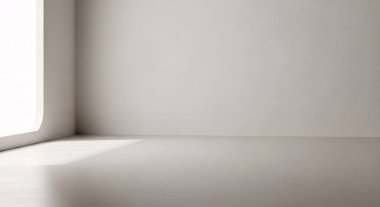 Parlak, boş bir iç köşe. Pencereden gelen yumuşak gün ışığı sakin gölgeler ve temiz boş bir yüzey yaratıyor.