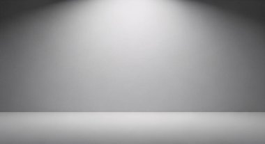 Tarafsız gri bir duvar ve zemin üzerinde yumuşak spot ışıklarıyla boş stüdyo arkaplanı, ürün ve sunum düzeni için ideal.