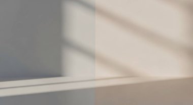 Calm interior scene with soft daylight filtering through blinds, creating geometric shadows on a smooth wall.
