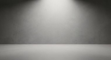 Gri bir duvar ve zeminde tek bir spot ışığı olan minimum boş stüdyo tasarım ve ürün çekimlerine uygun sakin ve dramatik bir ortam yaratıyor..