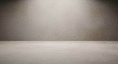 Yumuşak bir spot ışığıyla aydınlatılan temiz, boş bir stüdyo sahnesi hafif gölgelerle sakin bir ortam yaratıyor..