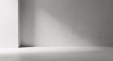 Yumuşak ışık ve gölgeli tek renkli iç köşe sakin, minimalist bir hava yaratıyor.