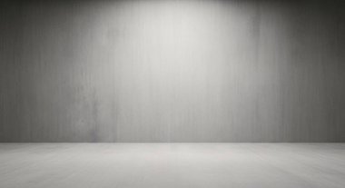 Duvarda ve yerde yumuşak gölgeler bırakan tek bir tepe lambası olan gri ölçekli boş bir stüdyo..