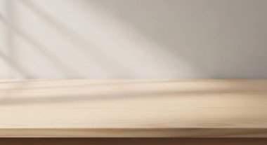 Yumuşak odaklı bir kitap, ahşap bir masada dinleniyor. Ilık bir ışık ve bulanık bir arkaplan..