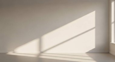Soft natural light creates geometric shadows on a plain wall, highlighting a calm and minimal interior atmosphere