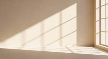 Soft warm light fills a quiet room as geometric shadows from a window lean across the wall.