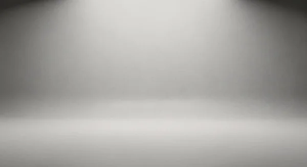 Minimum boş stüdyo sahnesi yumuşak gri ölçekli ışıklandırmayla yıkanarak ürün veya konsept fotoğrafçılık için sakin bir profesyonel zemin oluşturdu..