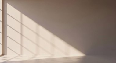 A calm interior scene featuring diagonal shadow lines created by window panes across a plain wall