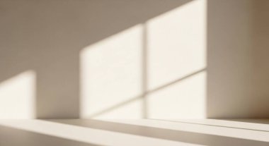 Minimalist interior scene with warm sunlight carving geometric rectangles on a smooth wall