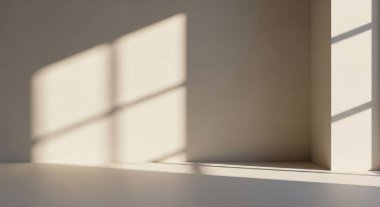 A minimal interior scene with warm sunlight streaming through a window, casting geometric shadows across a plain wall.