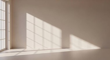 A quiet sunlit space featuring diagonal shadow patterns across a bare floor and wall.