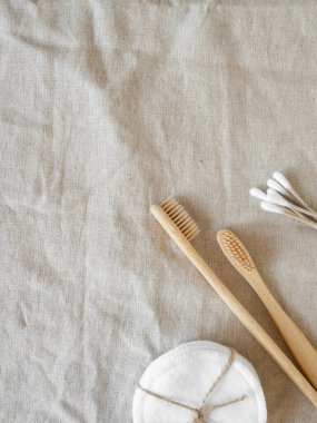 Minimal zero waste concept individual items for skin care and hygiene on natural textile background. Top view. Copy space
