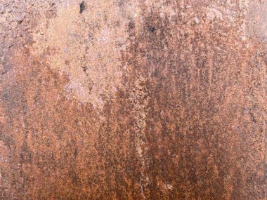 Paslı metal bir yüzeye yakın çekim, zengin dokusu ve ezmesi var. Yıpranmış ve oksitlenmiş, endüstriyel, grunge ya da çürük temalı arka plan ve tasarım elementleri için mükemmel..