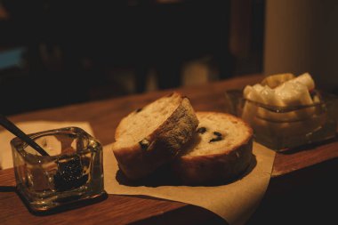 Olive Appetizer Bread and Black Olive Jam under Warm Light