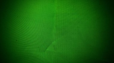 Soyut koyu yeşil desenli arka plan, hafif radyal kumaş desenleri ve vignettlerle.