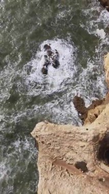 Ocean Waves Hitting the Cliffs of Algarve Coast in Portugal