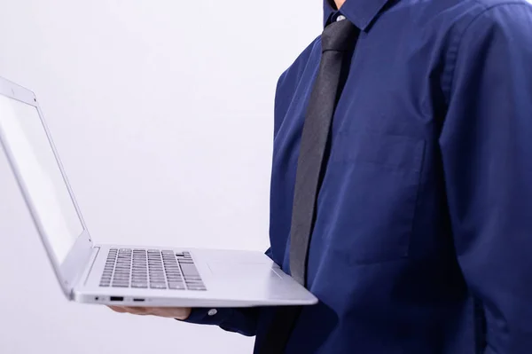 A person holding a laptop using a laptop