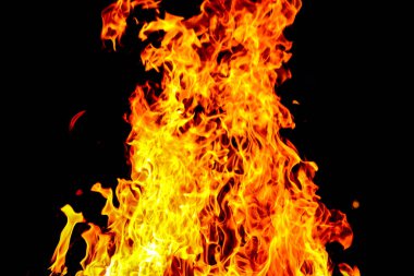 Alevlerin güçlü dikey alevleri koyu siyah bir arka plana doğru parlak bir şekilde parlıyor. Canlı sarı, turuncu ve kırmızı tonlar, ısı, tehlike, güç, yıkım ve ham elementsel gücü temsil eden dramatik bir andenerjik sahne oluşturur..