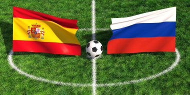 İspanya ile Rusya arasındaki uluslararası futbol maçında bayraklar ve çim stadyumunda top var.