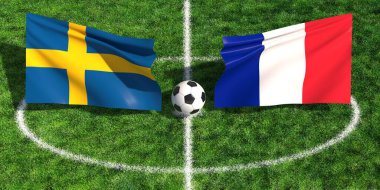 İsveç ve Fransız bayraklarının çimenli bir spor sahasında bir futbol topunun üzerinde sallanışının yüksek açılı görüntüsü