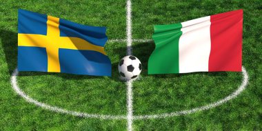 Çimenli bir spor sahasında futbol topunun üzerinde sallanan İsveç ve İtalyan bayraklarının yüksek açılı görüntüsü