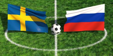 İsveç ve Rus bayraklarının çimenli bir spor sahasında bir futbol topunun üzerinde sallanışının yüksek açılı görüntüsü