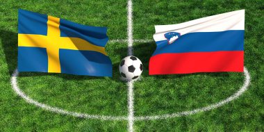 Çimenli bir spor sahasında futbol topunun üzerinde sallanan İsveç ve Slovenya bayraklarının yüksek açılı görüntüsü