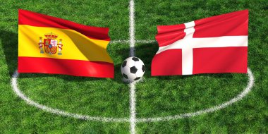 Bir futbol topu yeşil çimen sahasında İspanya ve Danimarka 'nın bayrakları arasında duruyor.