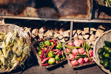 Farm ripe vegetables and fruits lying in wooden basket, grocery store organic market