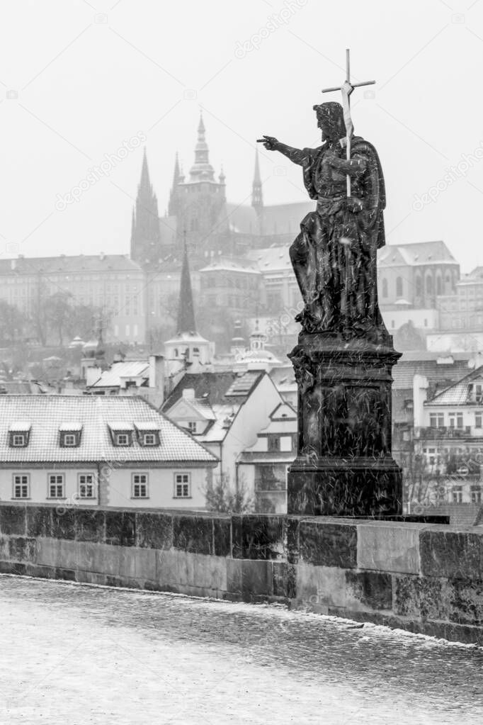 Charles Bridge is a historic bridge that crosses the Vltava river in Prague, Czech Republic. Its construction started in 1357 under the auspices of King Charles IV, and finished in the beginning of the 15th century. The bridge replaced the old Judith