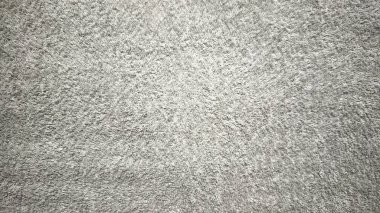 yumuşak açık gri tüylü halı dokusu ince derinde kabarık lifleri ortaya çıkarıyor, rahat minimalist atmosferi anımsatıyor dijital duvar kağıdı veya nötr afiş için mükemmel