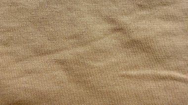 Sıcak bej kadife kumaş dokusu makro kaplama yatay çıkıntılar nötr ton örtüsü duvar kağıdı pankartı tasarımı için konforlu arka plan.