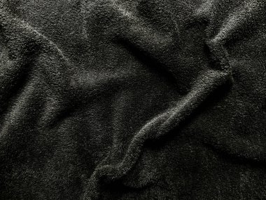 Lüks siyah kadife kumaş dokusu yumuşak zarif kıvrımlı, kaliteli koyu renkli duvar kağıdı ya da afiş alanı için.