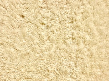 Lüks krem tüylü halı dokusu dingin, ev dekoru duvar kâğıdı veya zarif ticari arkaplan için ılık liflerle kaplı yumuşak lifler.