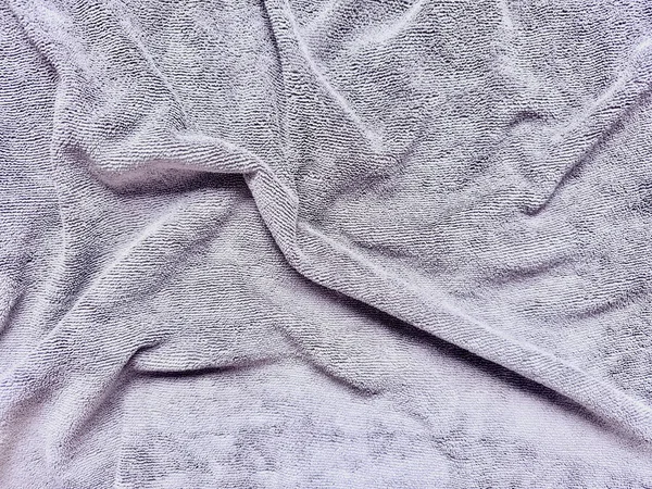Katlanmış gri havlu, spa markası ve web arkaplanı dokusu