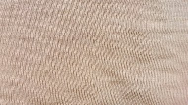 yumuşak bej tırtıklı örgü dokusu yakın plan tarafsız arkaplan, tasarım duvar kağıdı afişi için