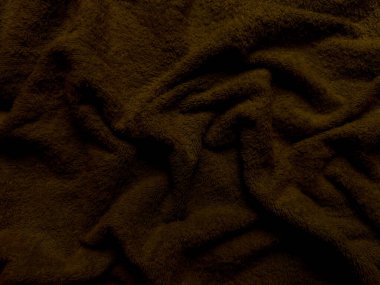 Zengin çikolatalı, tüylü kumaş dokusu. Duvar kağıdı ya da afiş arkaplanı için samimi sonbahar sıcaklığını çağrıştırıyor.