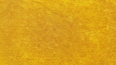 Altın sarısı kumaş kumaş dokusu. Duvar kağıdı ve tasarım arkaplanı için kusursuz desen.