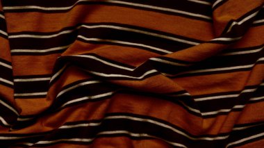 turuncu siyah çizgili kumaş dokuyu kapatır