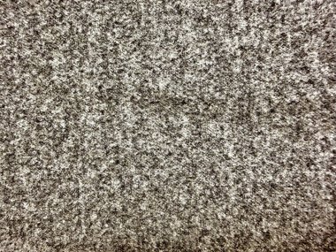 Granit desenli makro, pürüzlü doğal taş yüzeyinde benekli siyah gri mineral tanelerini ortaya çıkarıyor.