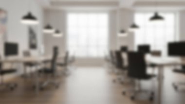 Modern, parlak bir ofis içinin bulanık bir görüntüsü..