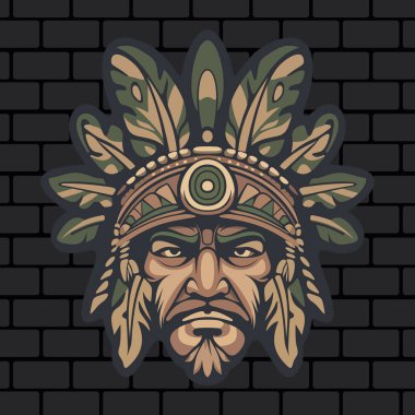 Sert yüzlü, stilize yapraklarla çevrili kabile maskeli savaşçı kızılderili. Tuğla duvarın arka planında süslü etnik detaylar var.