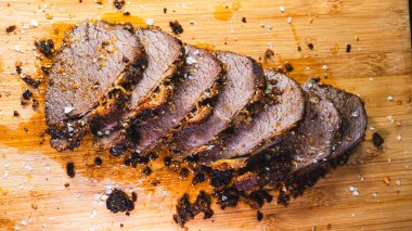 sliced beef steak on cutting board